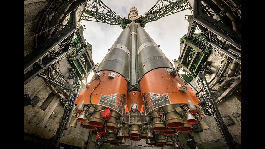 This bottom up view shows the Soyuz MS-24 rocket's first stage boosters as the spacecraft stands at its launch pad at the Baikonur Cosmodrome in Kazakhstan. Credit: NASA/Bill Ingalls