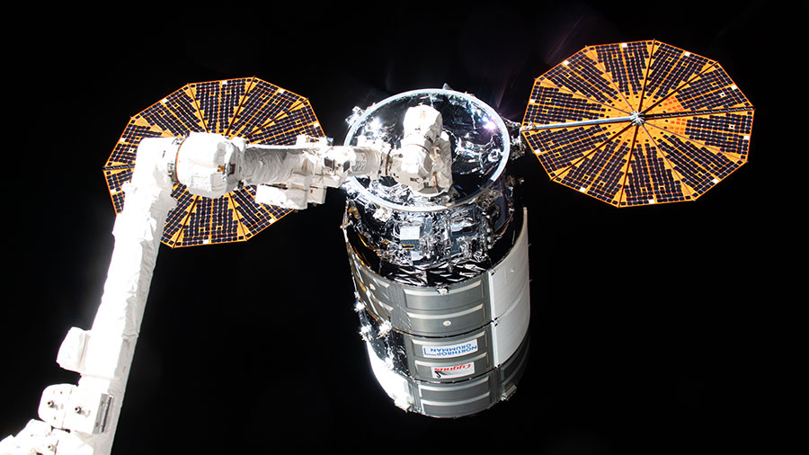 Northrop Grumman's Cygnus space freighter is pictured in the grips of the Canadarm2 robotic arm after its capture on Feb. 21, 2024.