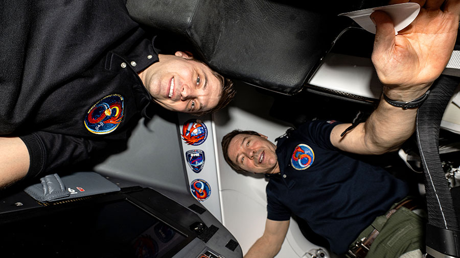 NASA astronauts (from left) Matthew Dominick and Mike Barratt are pictured wearing their SpaceX Crew-8 mission patch inside the SpaceX Dragon Endeavour spacecraft.