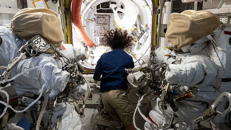 Astronaut Suni Williams works in the Quest airlock readying a pair of spacesuits that she and astronaut Nick Hague will wear during a spacewalk on Jan. 30, 2025.