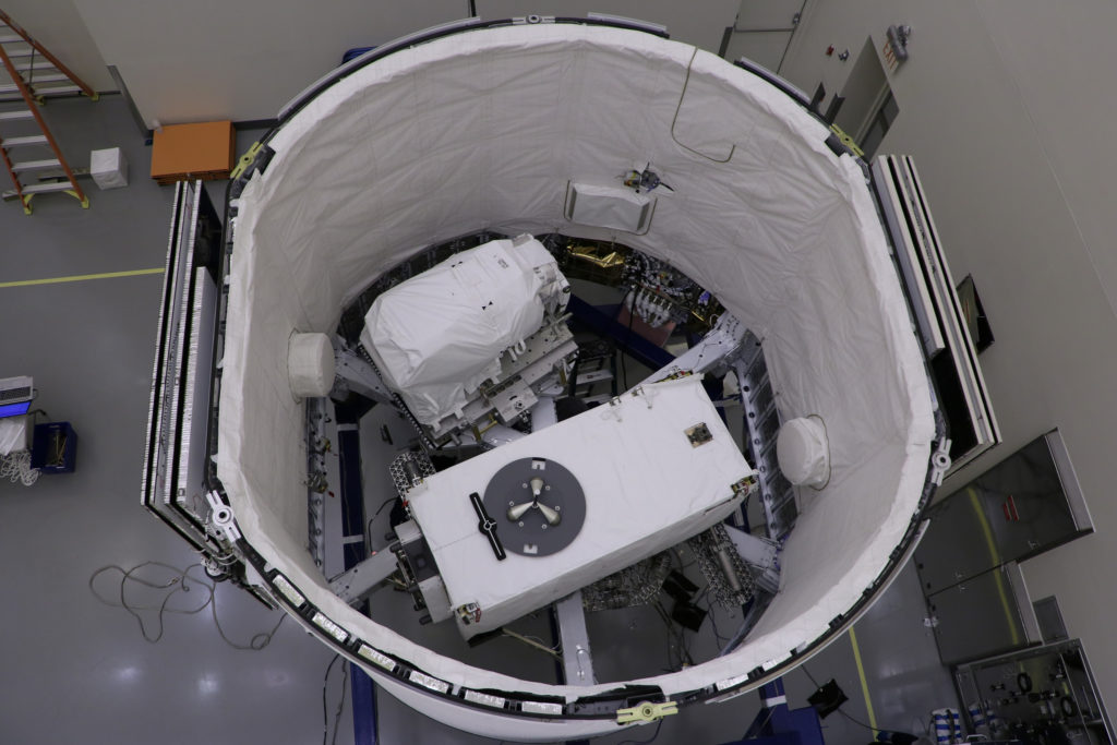 The ECOsystem Spaceborne Thermal Radiometer Experiment on Space Station (ECOSTRESS), pictured at the bottom, and the Latching End Effector (LEE), pictured at the top, are integrated into the unpressurized SpaceX Dragon truck June 2, 2018, at the SpaceX facility on Cape Canaveral Air Force Station in Florida.