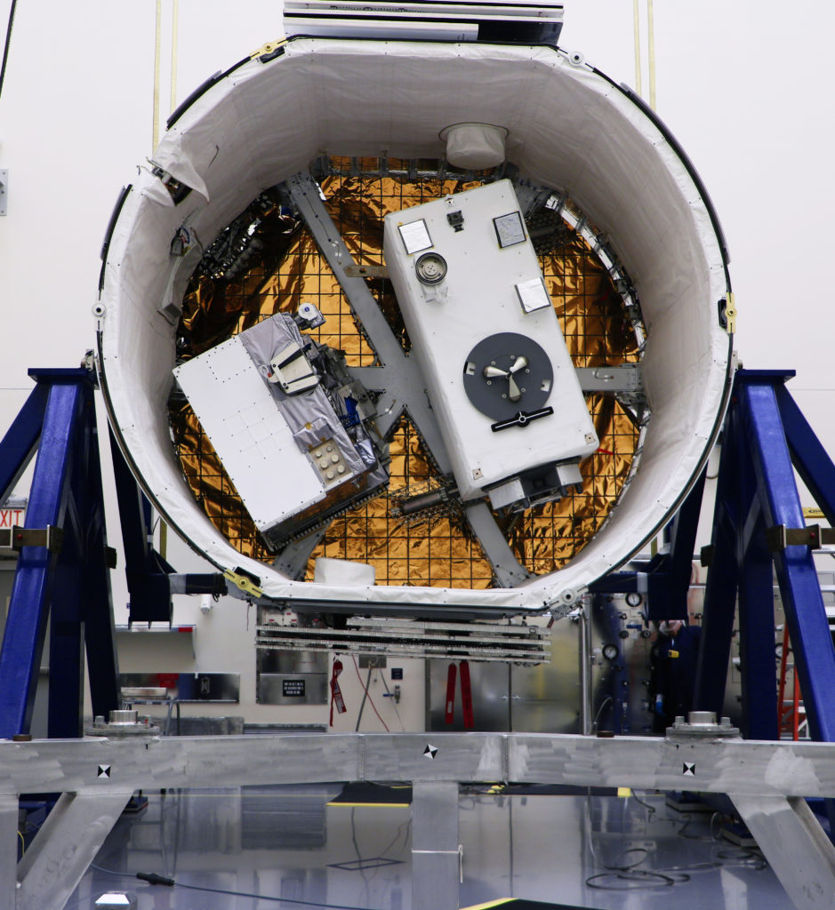 The Robotic Refueling Mission 3 (RRM3), at left, and the Global Ecosystem Dynamics Investigation (GEDI) are in the SpaceX Dragon unpressurized trunk.