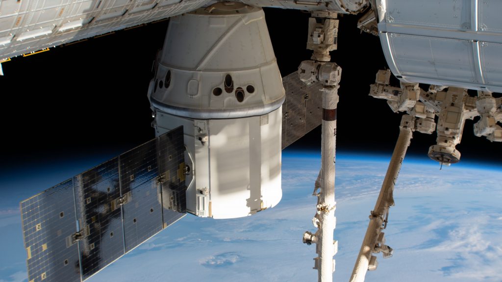 SpaceX Dragon connected to space station module