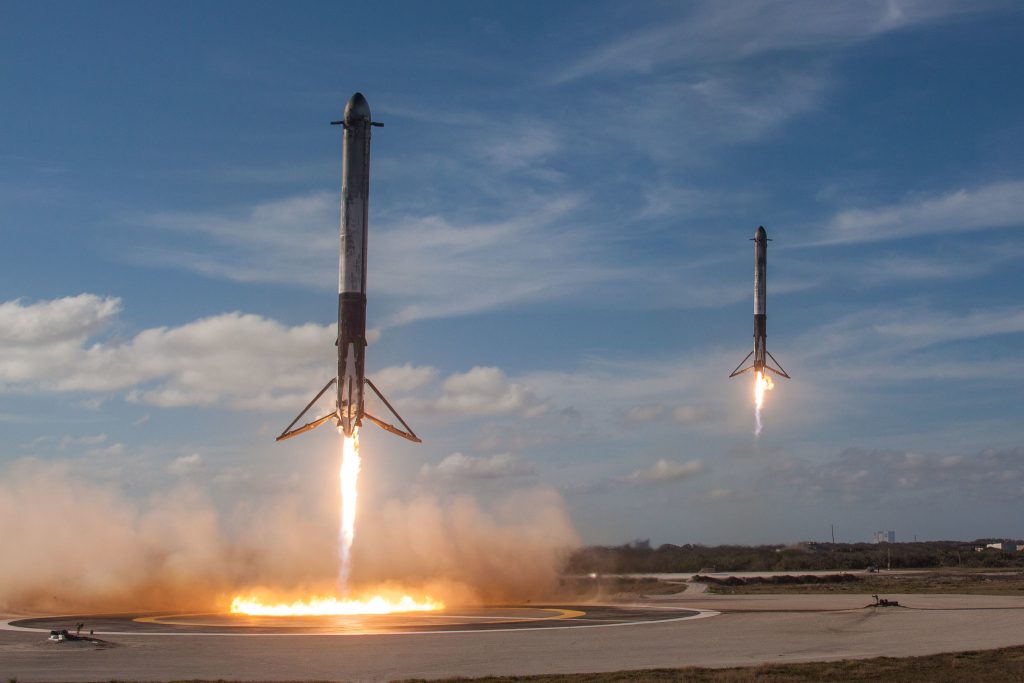 Side boosters from a SpaceX Falcon Heavy rocket land at Cape Canaveral's Landing Zone 1 and Landing Zone 2 in Florida on February 6, 2018.