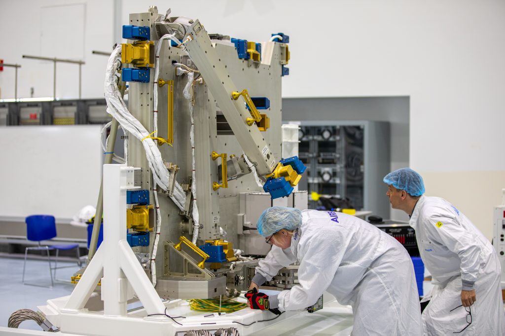 Airbus workers unpack the Bartolomeo platform in the Space Station Processing Facility high bay at NASA’s Kennedy Space Center in Florida on Jan. 30, 2020. 