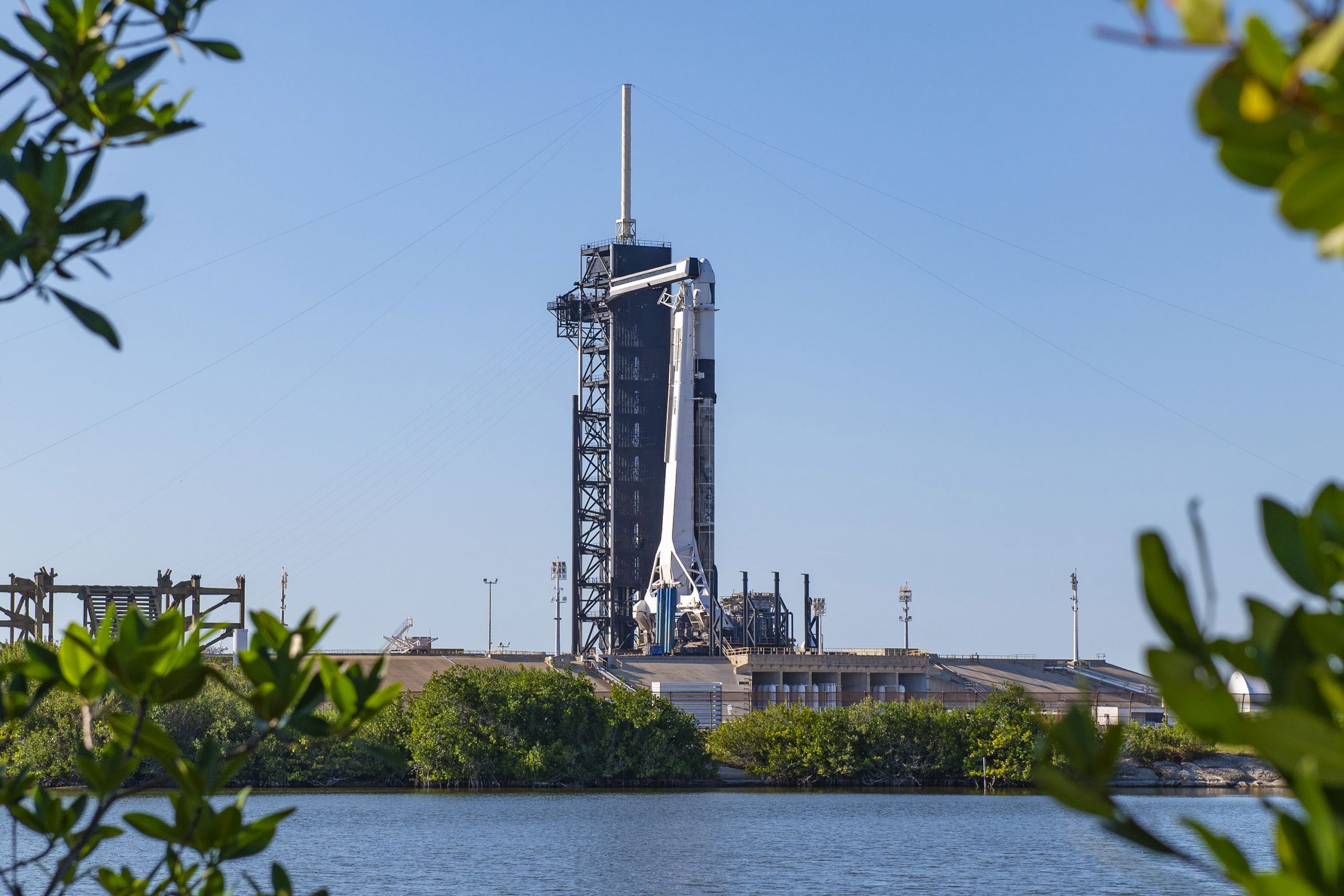 A SpaceX Falcon 9 rocket and cargo Dragon spacecraft stand ready for liftoff for the company's CRS-21 mission on Dec. 6, 2020.