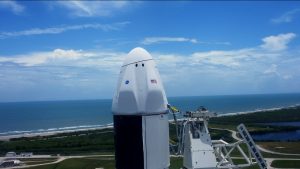 An up-close view of the Dragon spacecraft atop SpaceX's Falcon 9 rocket at Launch Complex 39A.