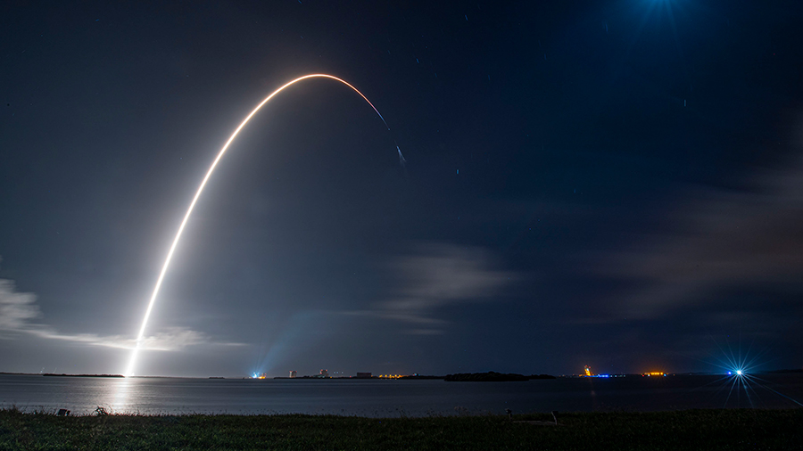 This long-duration photograph shows the SpaceX Falcon 9 rocket launching the Cargo Dragon spacecraft from NASA's Kennedy Space Center into Earth orbit. Credit: SpaceX