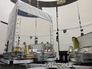 The Earth Surface Mineral Dust Source Investigation (EMIT) mission instrument (left) sits in the "trunk" that will travel aboard SpaceX's 25th cargo resupply mission.