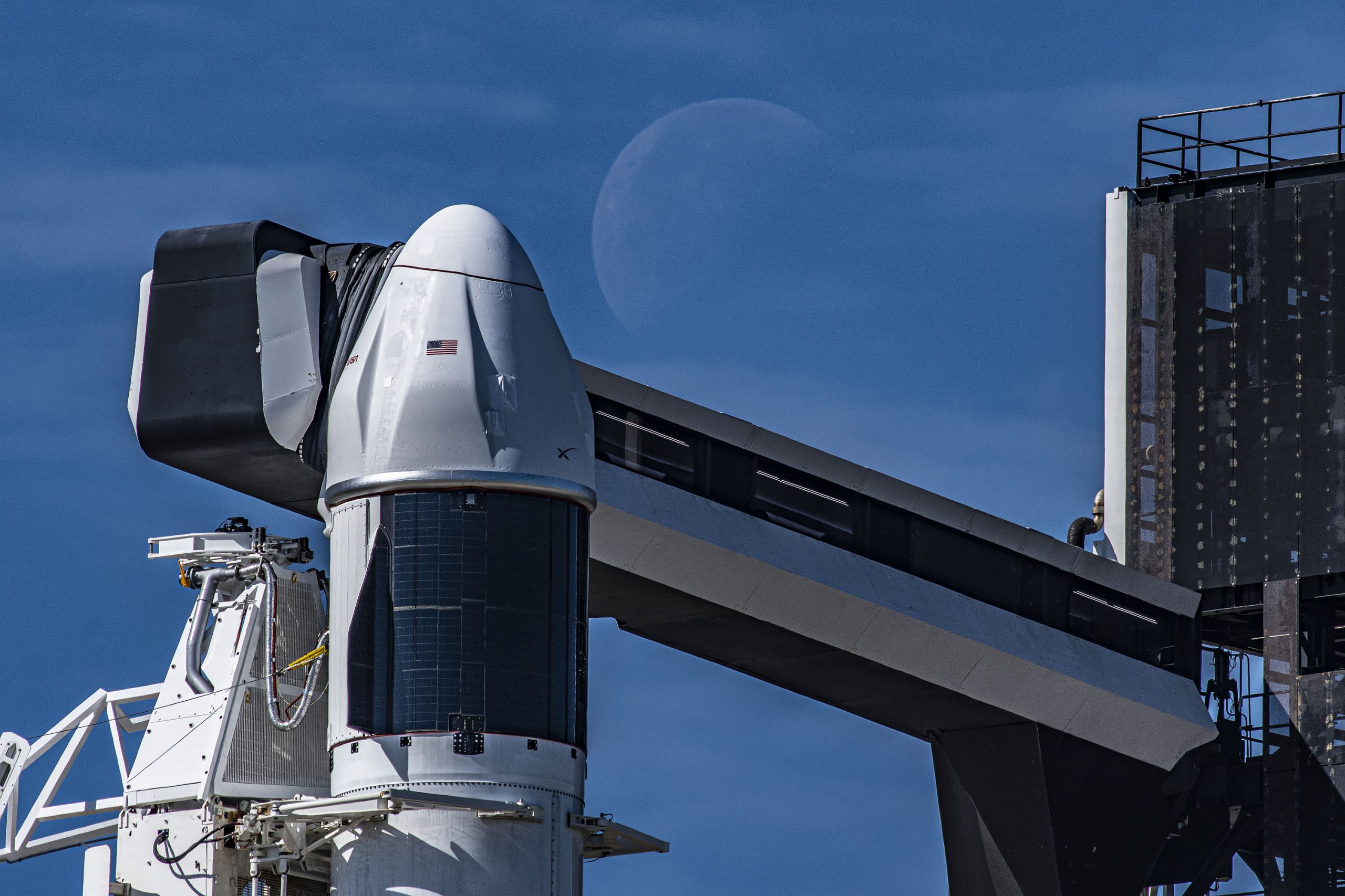 Seen here is a up-close view of the SpaceX Dragon spacecraft atop the company’s Falcon 9 rocket in the vertical position at NASA’s Kennedy Space Center in Florida ahead of SpaceX's 27th resupply services launch.