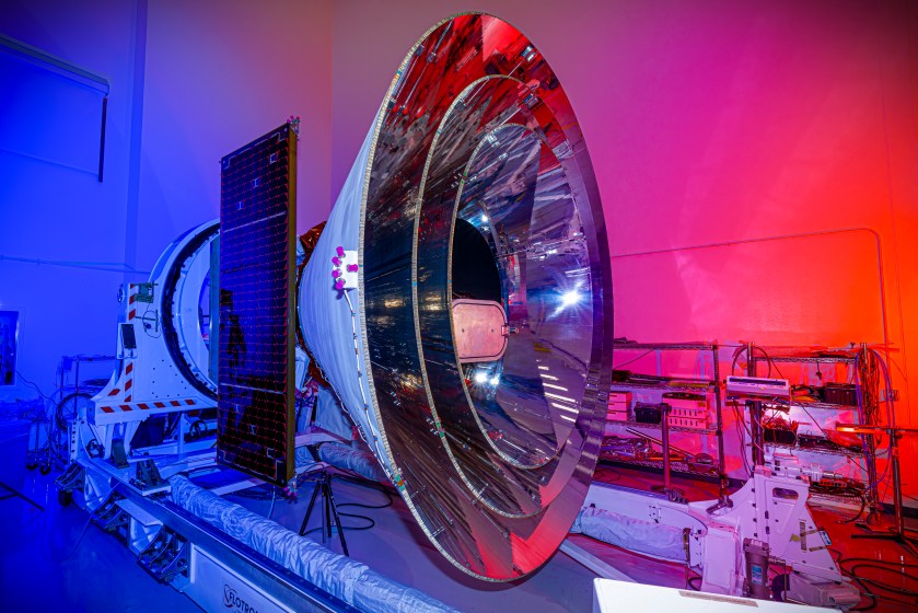 NASA’s SPHEREx space observatory was photographed at BAE Systems in Boulder, Colorado, in November 2024 after completing environmental testing. The spacecraft’s three concentric cones help direct heat and light away from the telescope and other components, keeping them cool. 