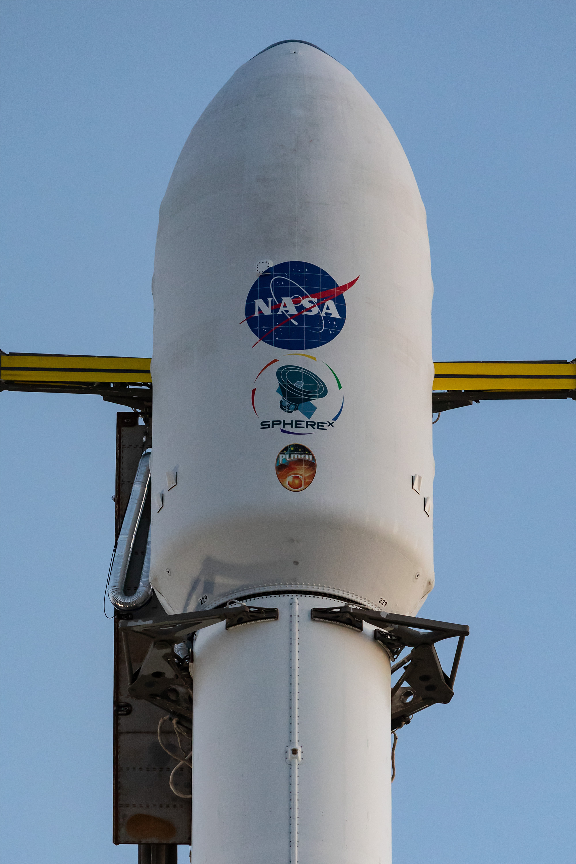 A SpaceX Falcon 9 rocket, carrying NASA’s SPHEREx (Spectro-Photometer for the History of the Universe, Epoch of Reionization and Ices Explorer) observatory and PUNCH (Polarimeter to Unify the Corona and Heliosphere) satellites, is vertical at Space Launch Complex 4 East from Vandenberg Space Force Base in California on Saturday March 8, 2025. SPHEREx will use its telescope to provide an all-sky spectral survey, creating a 3D map of the entire sky to help scientists investigate the origins of our universe. PUNCH will study origins of the Sun’s outflow of material, or the solar wind, capturing continuous 3D images of the Sun’s corona and the solar wind’s journey into the solar system. 