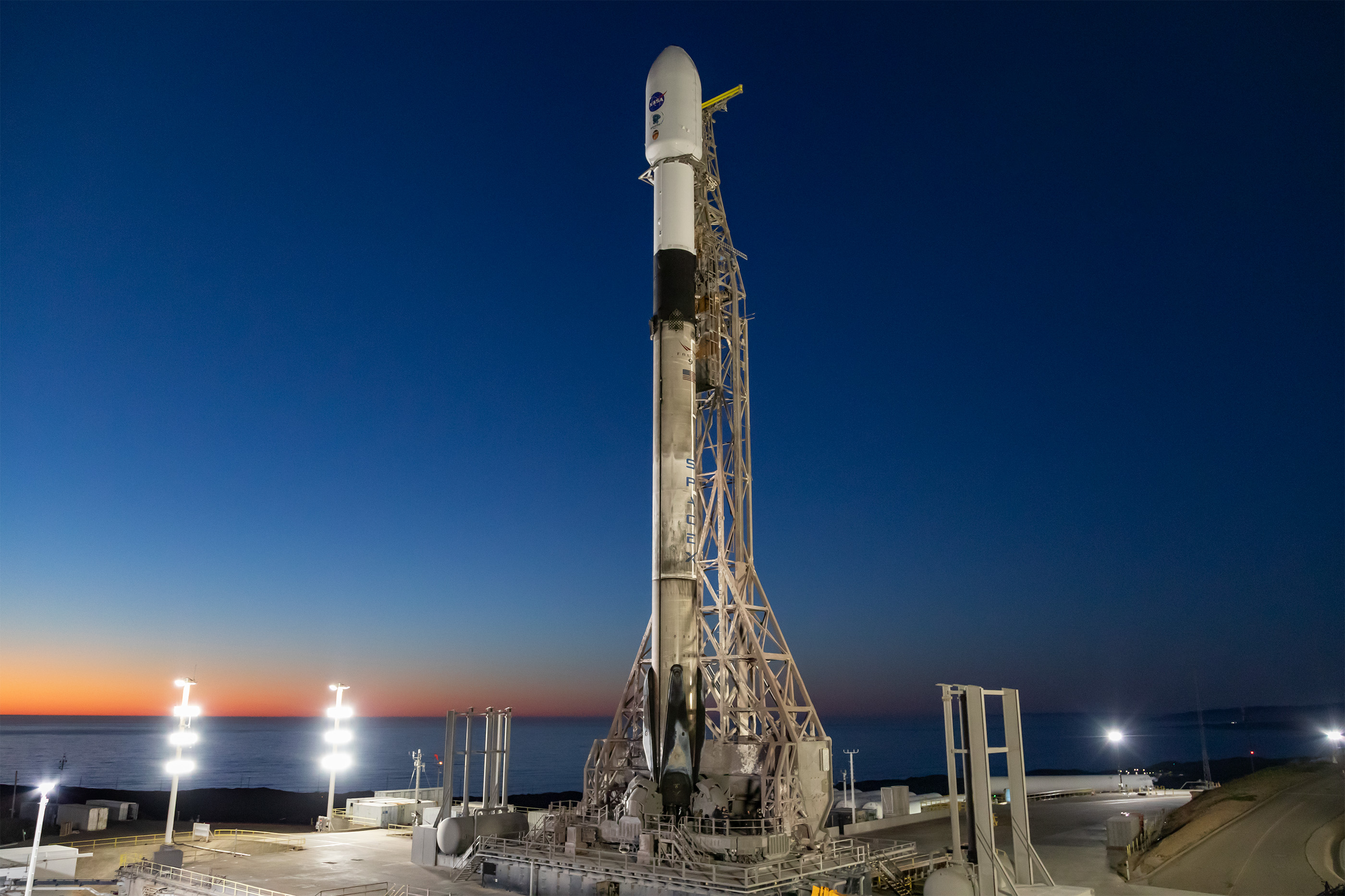 A SpaceX Falcon 9 rocket, carrying NASA’s SPHEREx (Spectro-Photometer for the History of the Universe, Epoch of Reionization and Ices Explorer) observatory and PUNCH (Polarimeter to Unify the Corona and Heliosphere) satellites, is vertical at Space Launch Complex 4 East from Vandenberg Space Force Base in California on Saturday, March 8, 2025. SPHEREx will use its telescope to provide an all-sky spectral survey, creating a 3D map of the entire sky to help scientists investigate the origins of our universe. PUNCH will study origins of the Sun’s outflow of material, or the solar wind, capturing continuous 3D images of the Sun’s corona and the solar wind’s journey into the solar system.