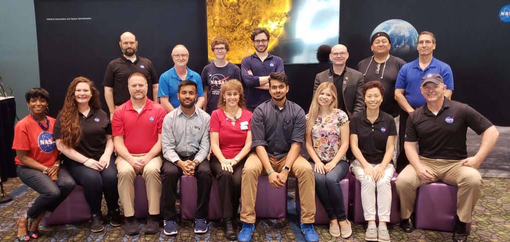 A group of people from the NASA and ISTE partnership posing in the NASA Playground at ISTE.