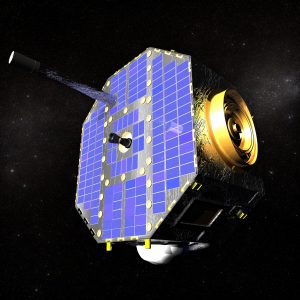 The IBEX spacecraft against the starry expanse of space. IBEX is an octagon covered in blue panels. Antennae and other detectors in gold protrude from the spacecraft.