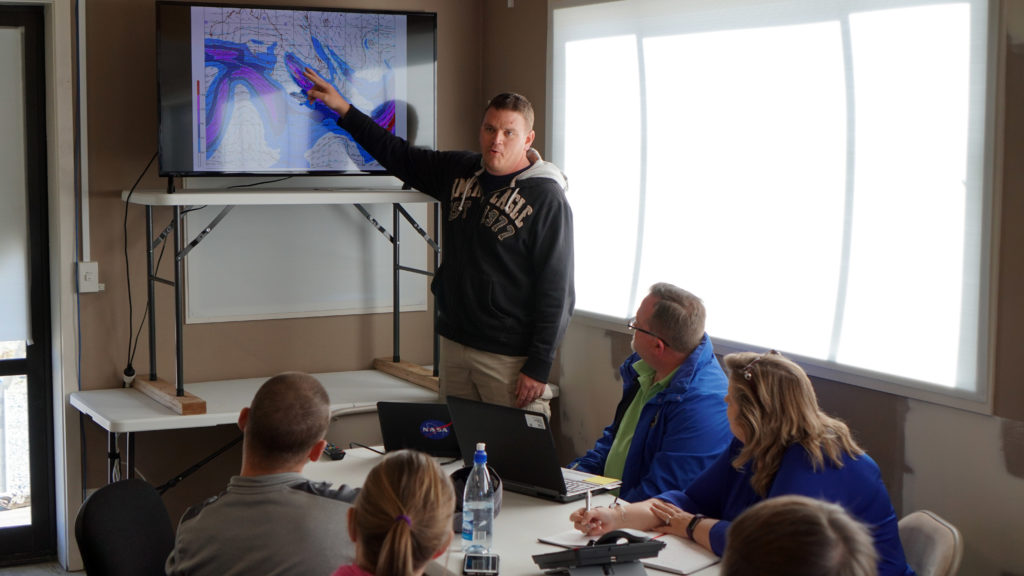 Chris Schwantes, meteorologist with NASA's Columbia Scientific Balloon Facility, provides a daily weather briefing to the super pressure balloon team March 30 at Wanaka Airport, New Zealand. (NASA/Bill Rodman)