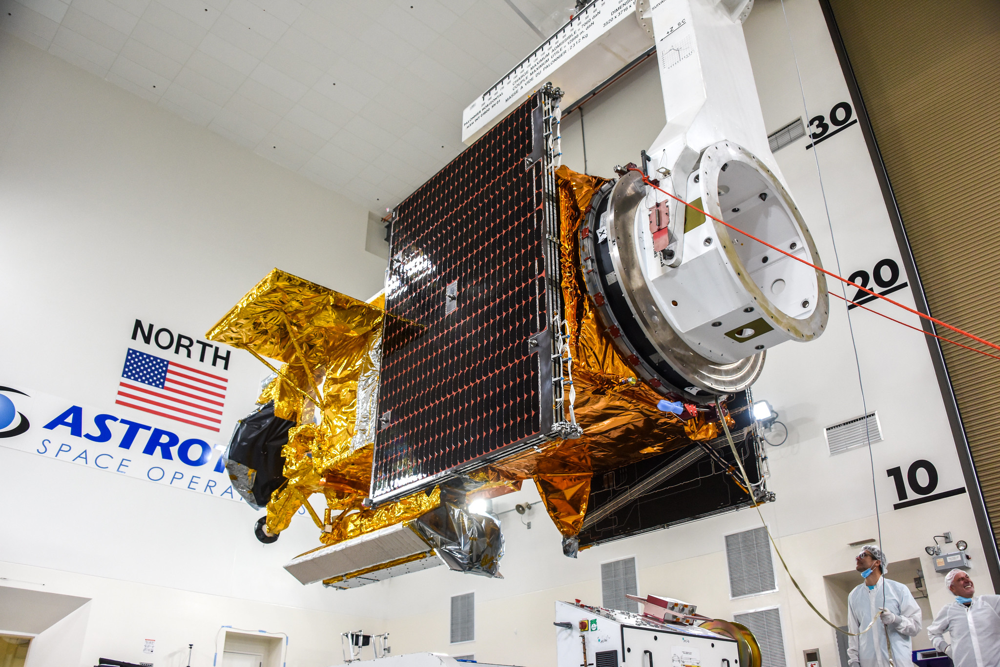 The Surface Water and Ocean Topography (SWOT) spacecraft is moved into a transport container inside the Astrotech facility at Vandenberg Space Force Base in California