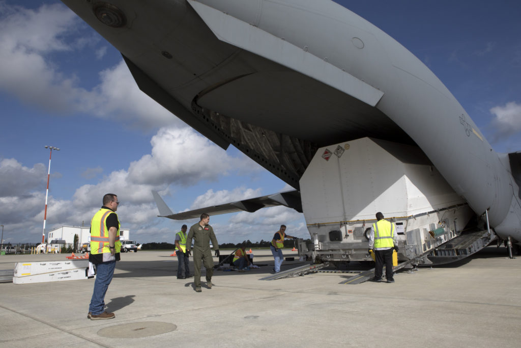 NASA's TDRS-M satellite arrives inside its shipping container at Space Coast Regional Airport in Titusville, Florida, aboard a U.S. Air Force transport aircraft. 