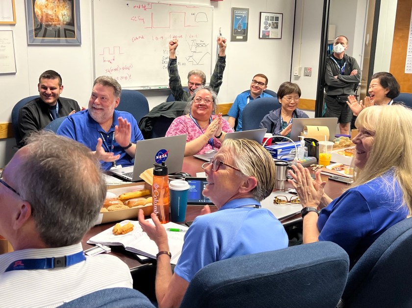 After receiving data about the health and status of Voyager 1 for the first time in five months, members of the Voyager flight team celebrate in a conference room at NASA’s Jet Propulsion Laboratory on April 20.