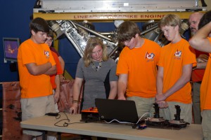 Dr. Stofan participating in FIRST Robotics demonstration with members of the Gulfport High School Robotics Team (Gulfport, MS)