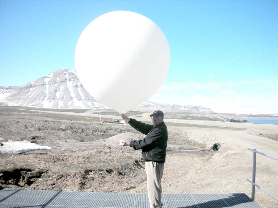 NASA Ames Center Director Pete Worden holding a balloon at Svalbard