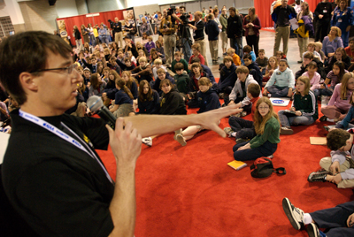 Chris moderating an astronaut panel.