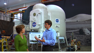 Chris is learning more about the Inflatable Lunar Habitat concept from Karen Whitley.