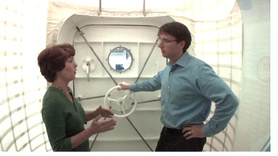 Karen Whitley and Chris inside the airlock section of the hab.