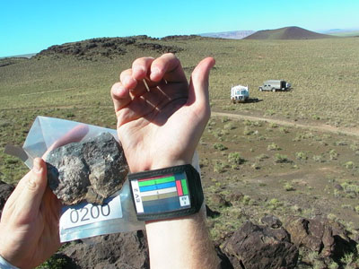 Stan Love holding up sample rock