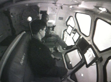 Crewmates José Hurtado and Alvin Drew participate in an MMSEV             flying simulation.