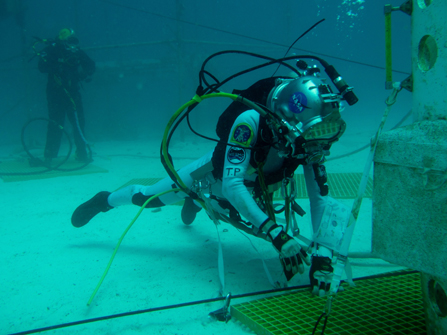 Aquanaut Tim Peake prepares to anchor so he has a stable platform from which to gather samples