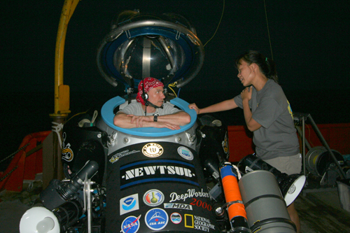 Image of Dr. Love preparing for a night flight in the deepworker sub. Darlene Lim also pictured.