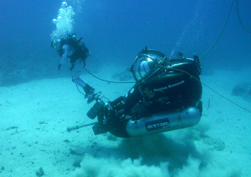 Photo of Aquanuat Steve Squyres mounted to a DeepWorker Sub.