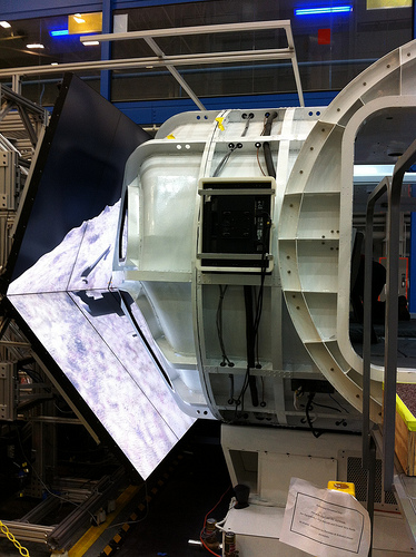 The Multi-Mission Space Exploration Vehicle (MMSEV) viewed from outside during the RATS simulated mission; video screens in front of the MMSEV windows project images of the asteroid as crew members pilot the MMSEV. Photo credit: NASA