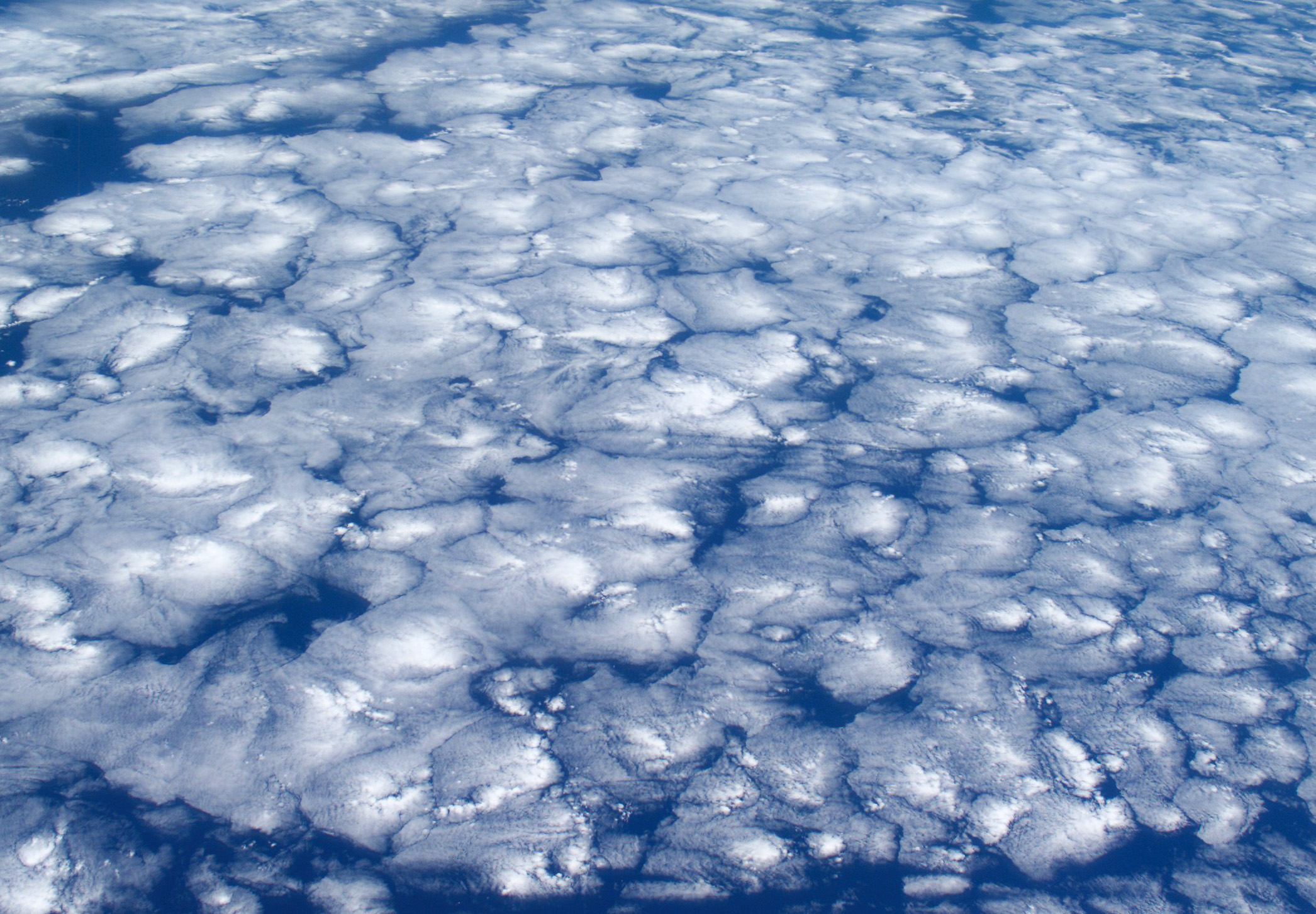 Islands of blue (actually clouds), as seen by an explorer on the orbital frontier.