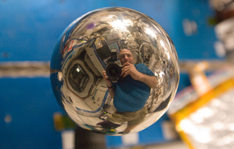 ISS030-E-175968 -- Reflection in a metal sphere.