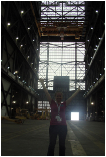 Mindi Capp stands inside a large building