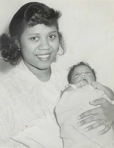 Young Harriette holding newborn CIO Linda