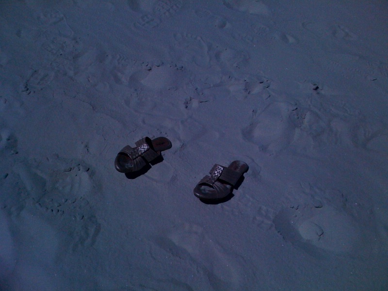 CIO's shoes and footprints in sand