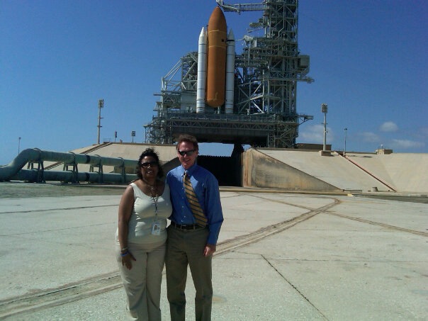 Kennedy Space Center CIO Mike Bolger with NASA CIO Linda Cureton with Space Shuttle in background