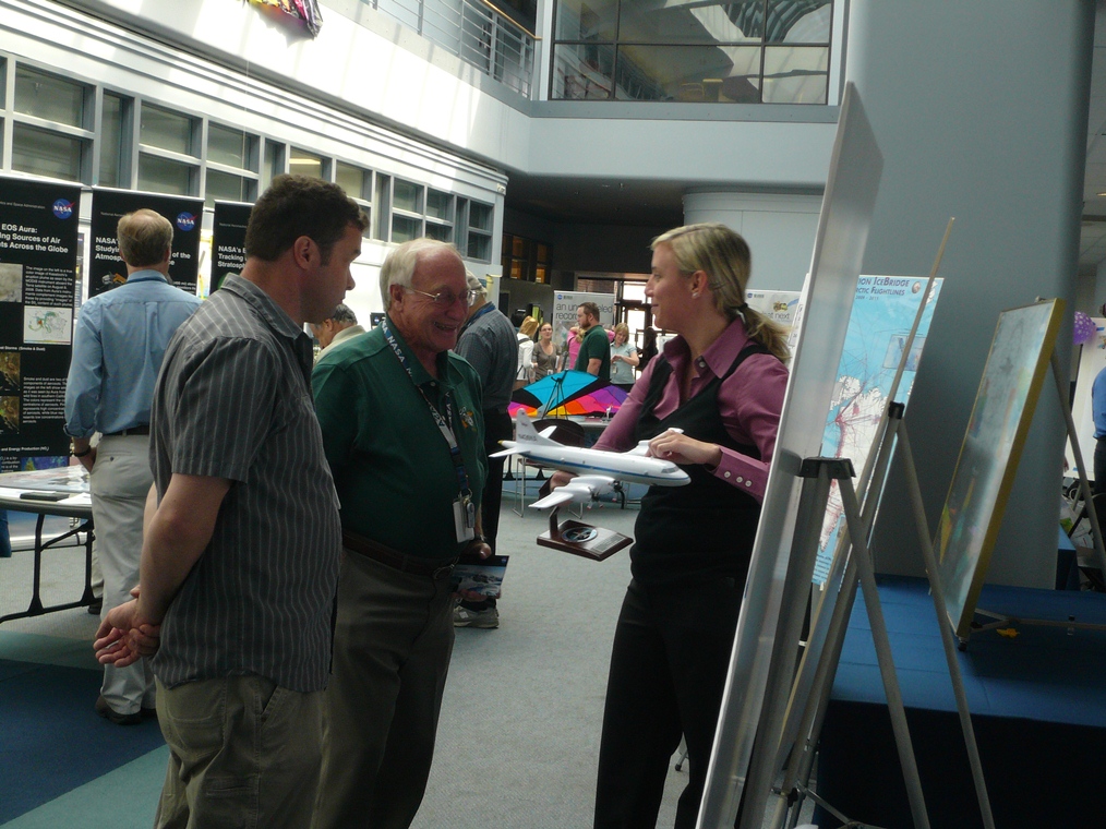 IceBridge project scientist Michael Studinger (left) and project manager Christy Hansen (right) at the Operation IceBridge display table