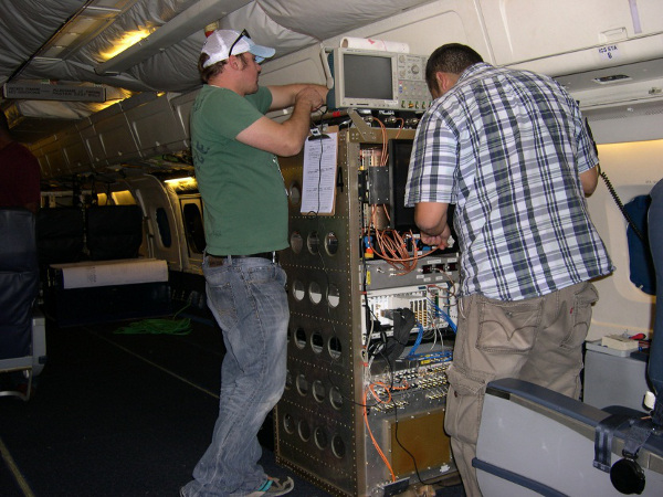 University of Kansas Fernando Rodriguez-Morales & Bryan Townley work the MCoRDS Radar instrument installation