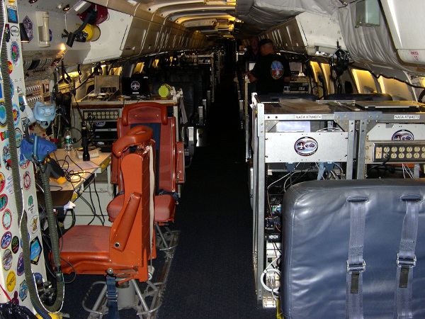 NASA Techs Kevin Mount and Terrance Dilworth accomplish instrument rack inspections on the DC-8